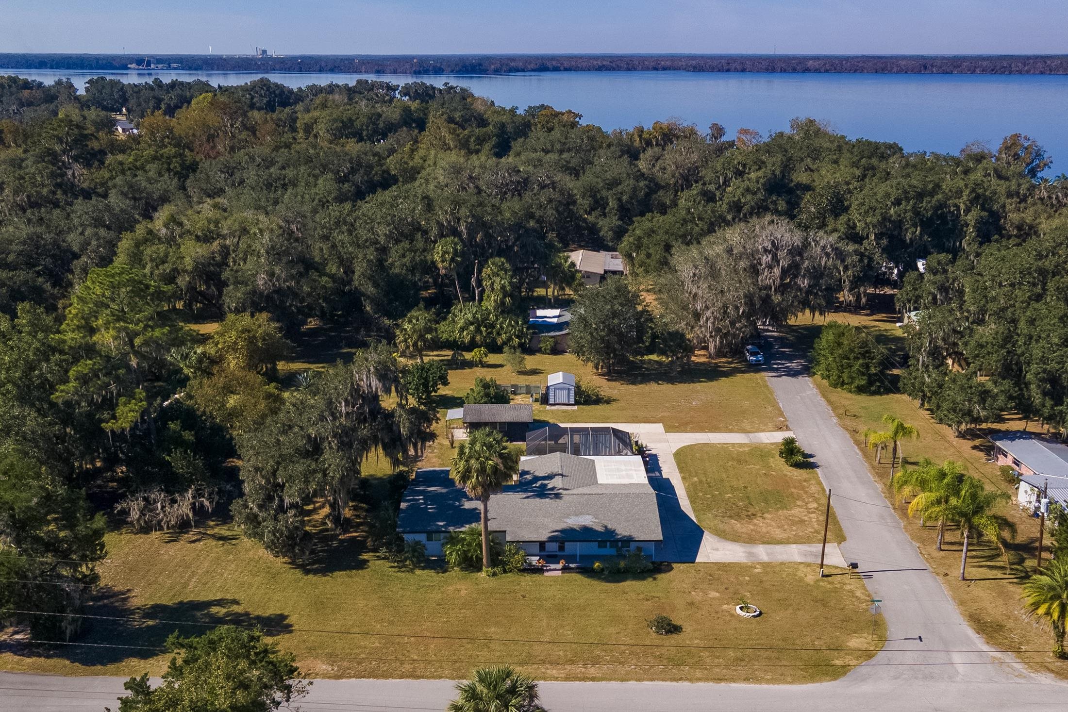 123 Esperanza Grove Road East Palatka, FL 32131 - Photo 44 of 59 Bird's eye view of a heavily wooded area and a nearby body of water