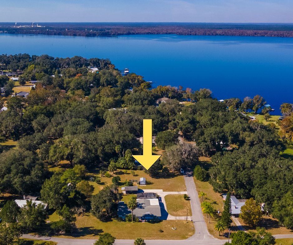 123 Esperanza Grove Road East Palatka, FL 32131 - Photo 45 of 59 Aerial view of property and surrounding area featuring a large body of water