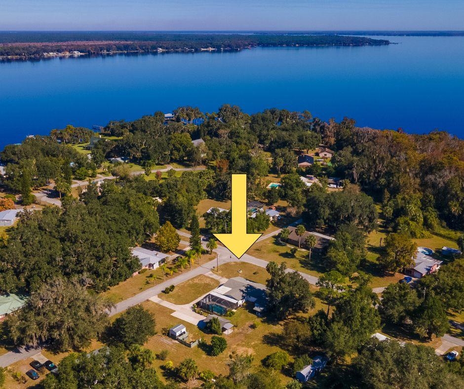 123 Esperanza Grove Road East Palatka, FL 32131 - Photo 50 of 59 Aerial view of residential area featuring a large body of water
