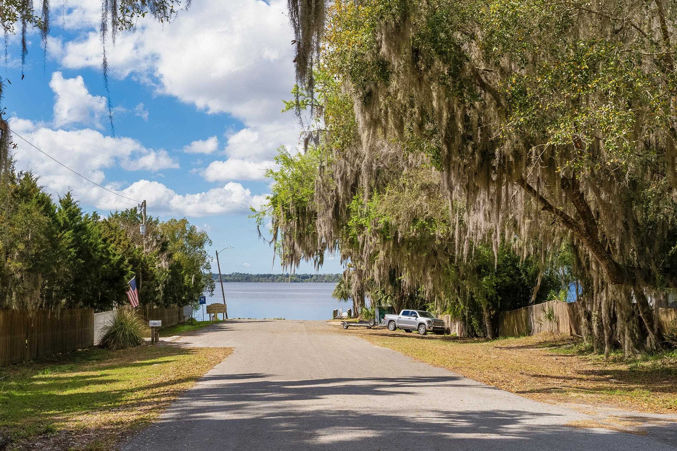123 Esperanza Grove Road East Palatka, FL 32131 - Photo 54 of 59 View of asphalt street with a boat ramp, a water view, and street lights