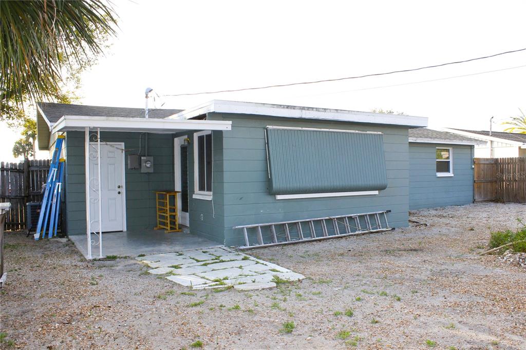 3542 Connon Drive New Port Richey, FL 34652 - Photo 16 of 47 a view of a house with a wooden fence