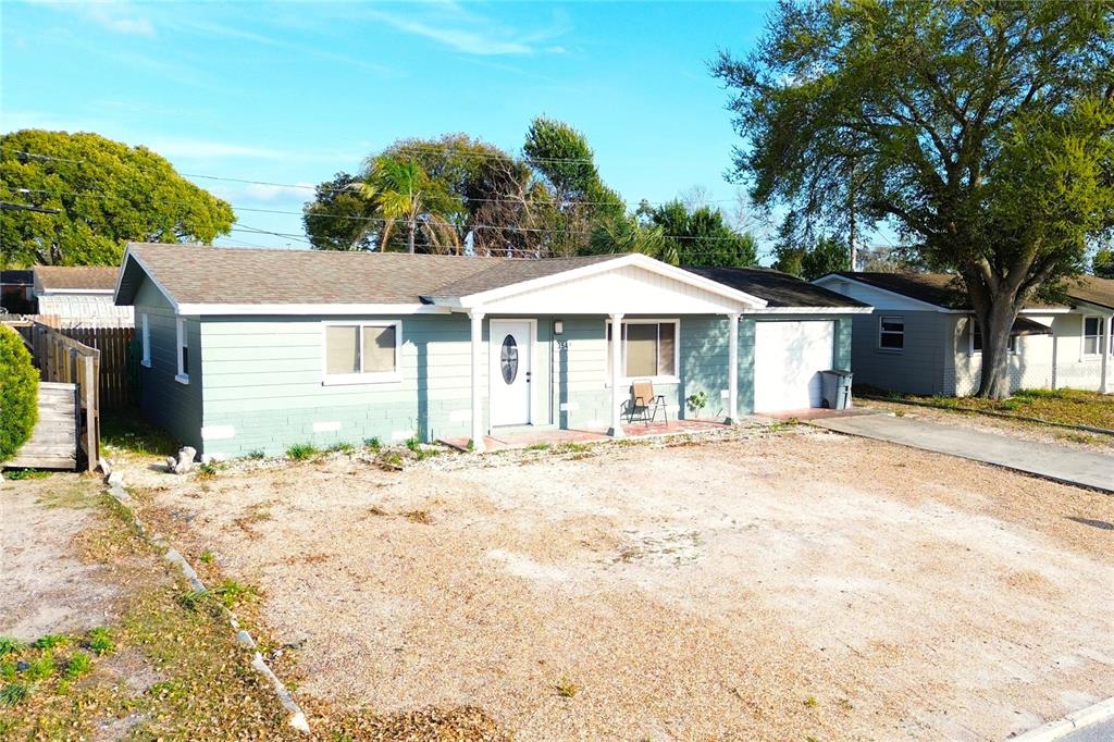 3542 Connon Drive New Port Richey, FL 34652 - Photo 17 of 47 a white house with a large tree in front of it