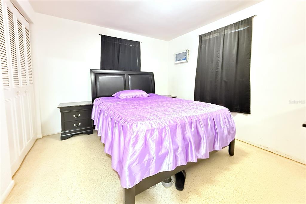 3542 Connon Drive New Port Richey, FL 34652 - Photo 23 of 47 a bedroom with a bed and a closet