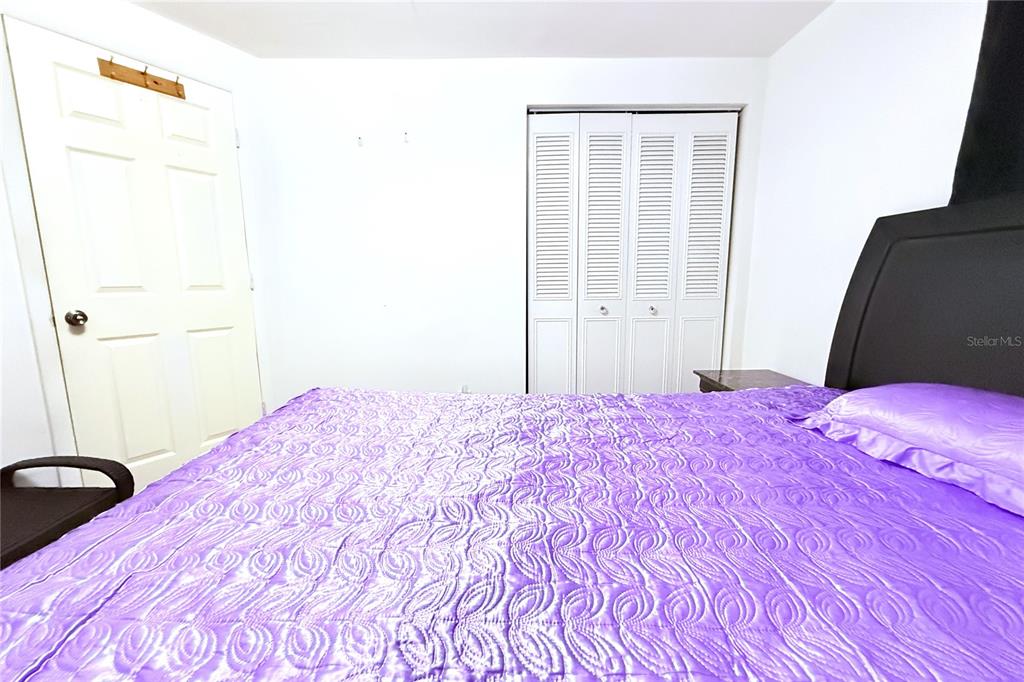 3542 Connon Drive New Port Richey, FL 34652 - Photo 26 of 47 a bedroom with a bed and a mirror