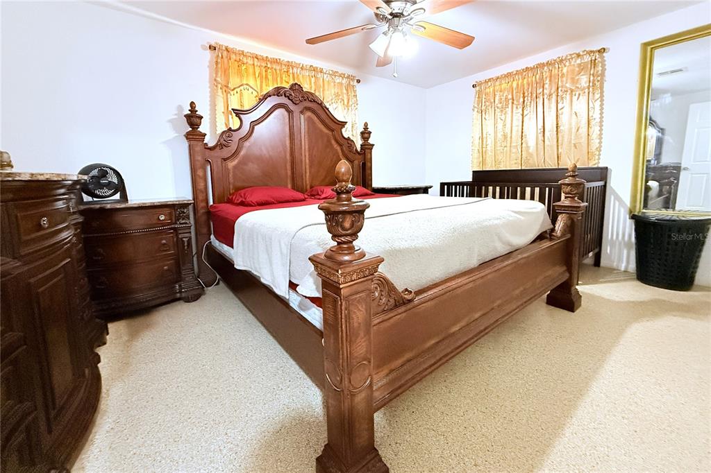 3542 Connon Drive New Port Richey, FL 34652 - Photo 27 of 47 a bed sitting in a bedroom next to a window