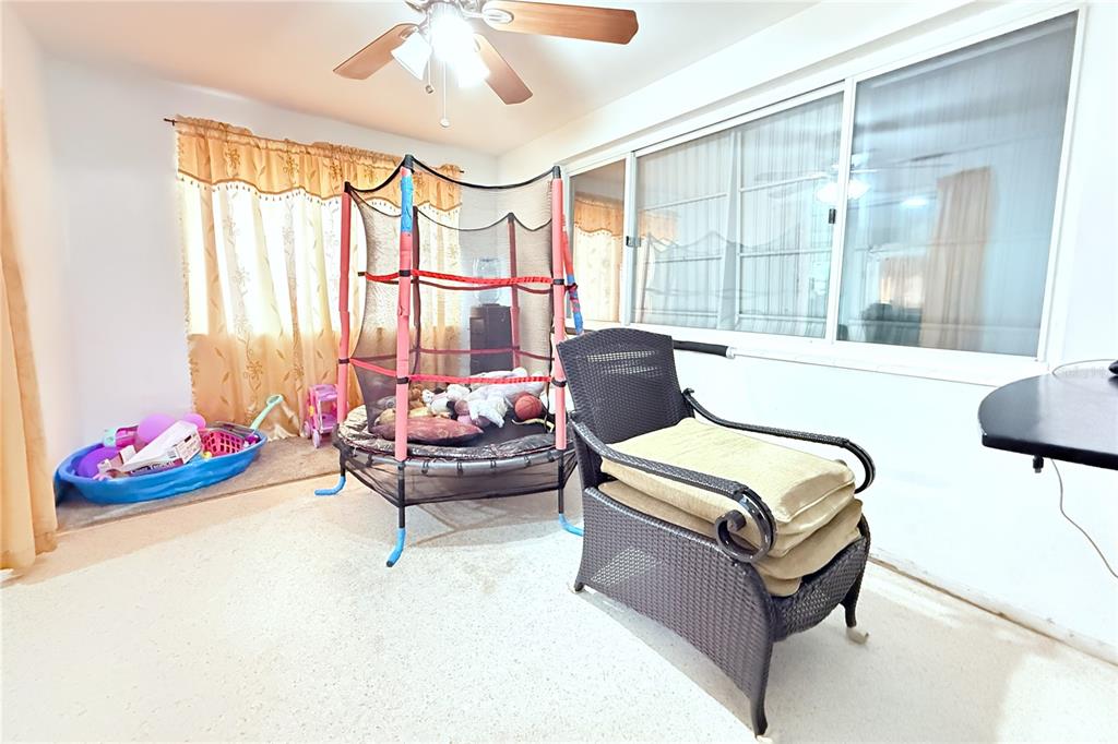 3542 Connon Drive New Port Richey, FL 34652 - Photo 29 of 47 a living room with furniture and a large window