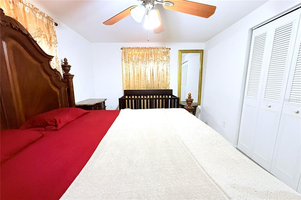 3542 Connon Drive New Port Richey, FL 34652 - Photo 31 of 47 a bedroom with a bed and a window