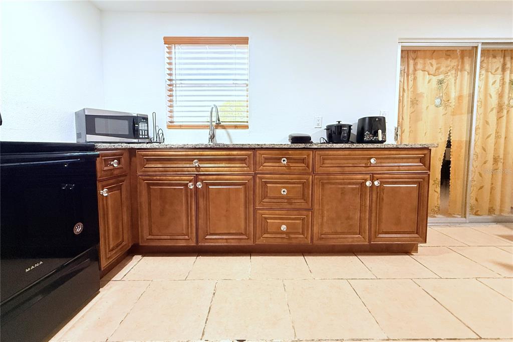 3542 Connon Drive New Port Richey, FL 34652 - Photo 34 of 47 a kitchen with granite countertop a sink