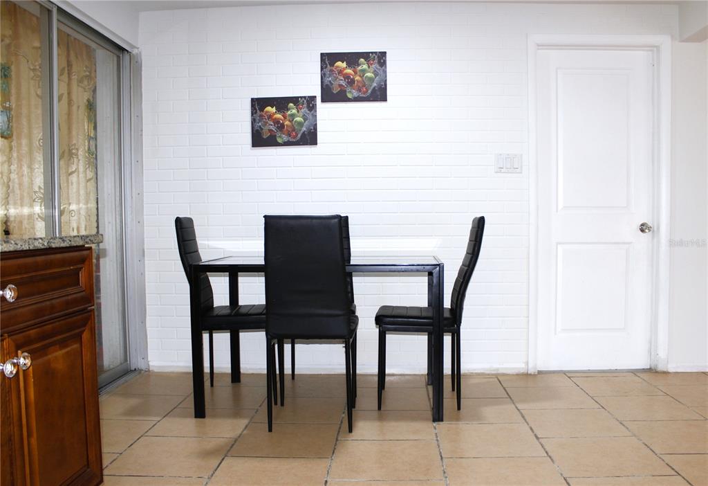 3542 Connon Drive New Port Richey, FL 34652 - Photo 38 of 47 a view of a dining room with furniture and a window