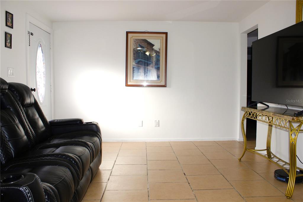 3542 Connon Drive New Port Richey, FL 34652 - Photo 41 of 47 a bedroom with a bed and a television