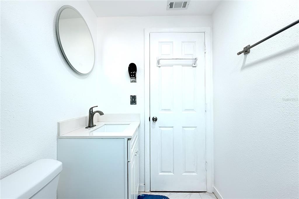 3542 Connon Drive New Port Richey, FL 34652 - Photo 43 of 47 a bathroom with a sink and a mirror