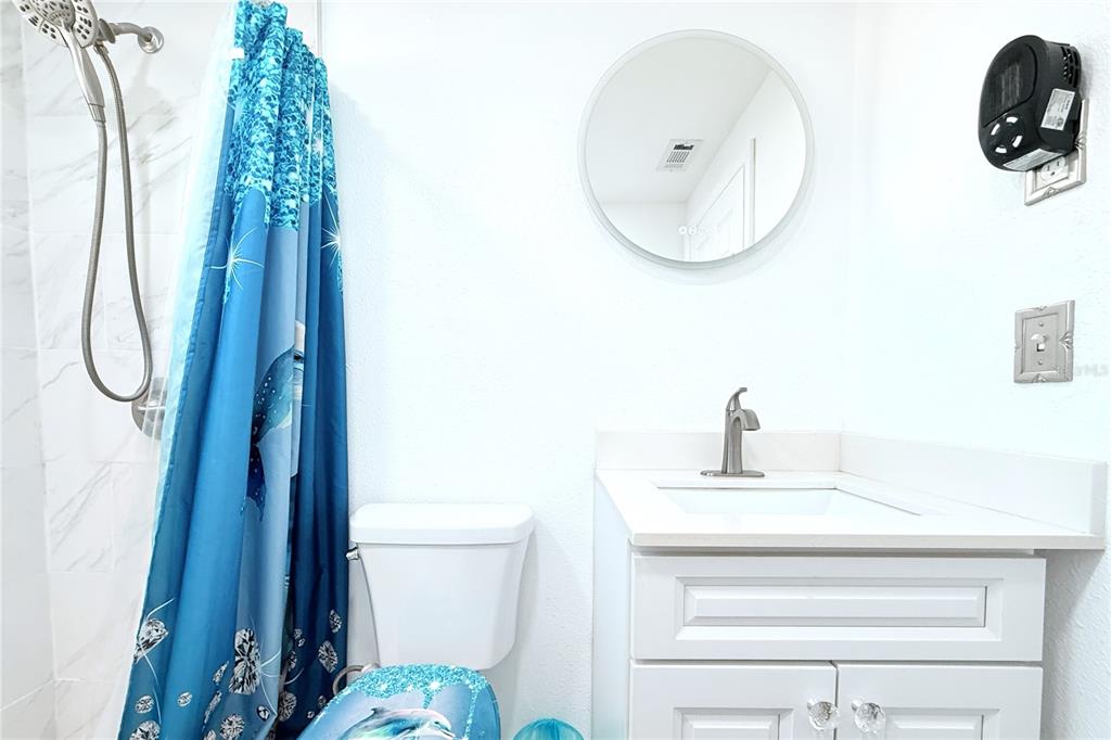 3542 Connon Drive New Port Richey, FL 34652 - Photo 45 of 47 a bathroom with a sink and a mirror