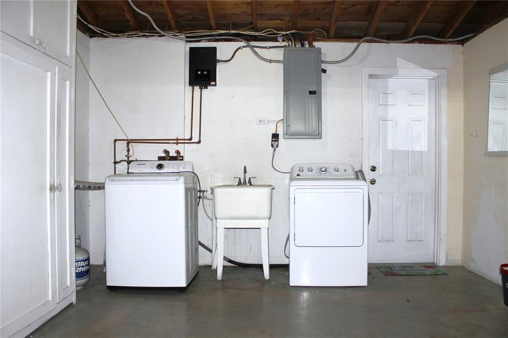 3542 Connon Drive New Port Richey, FL 34652 - Photo 47 of 47 a utility room with dryer and washer