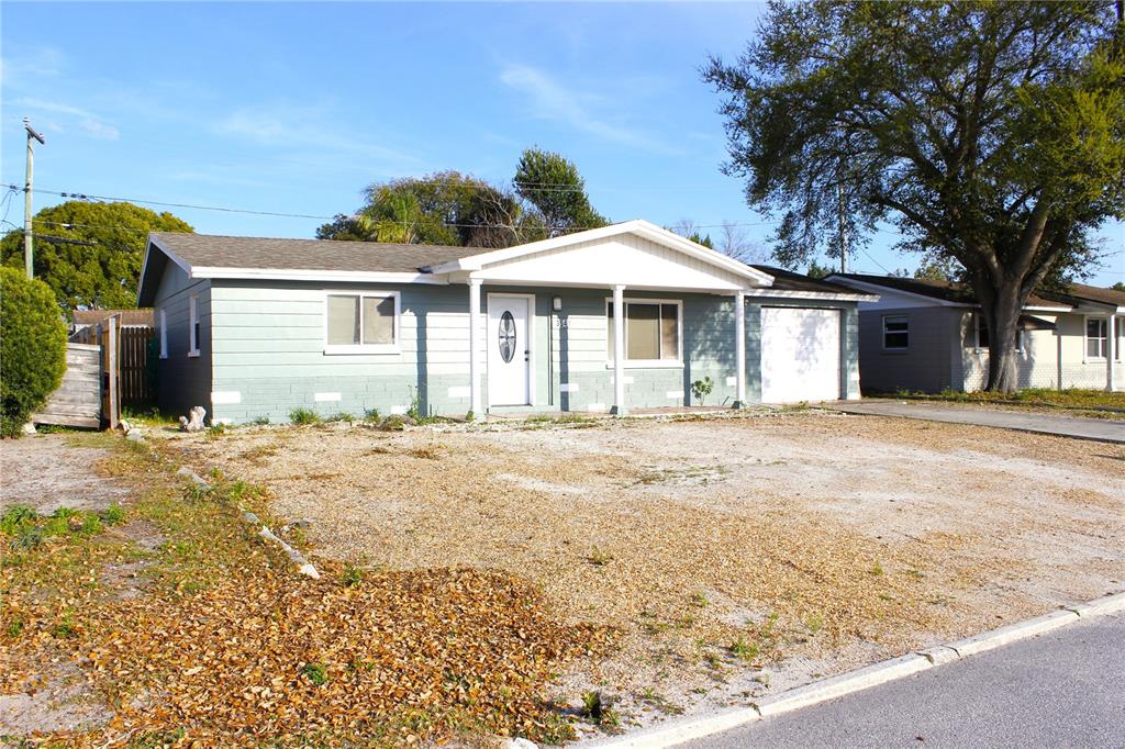 3542 Connon Drive New Port Richey, FL 34652 - Photo 7 of 47 a front view of a house with a yard