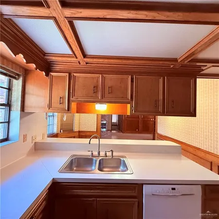 a kitchen with a sink and a refrigerator