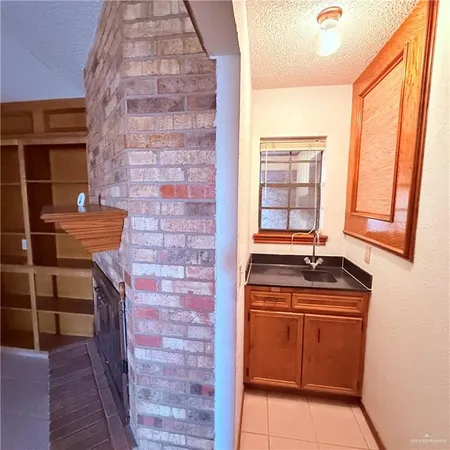 a bathroom with a sink a toilet and window