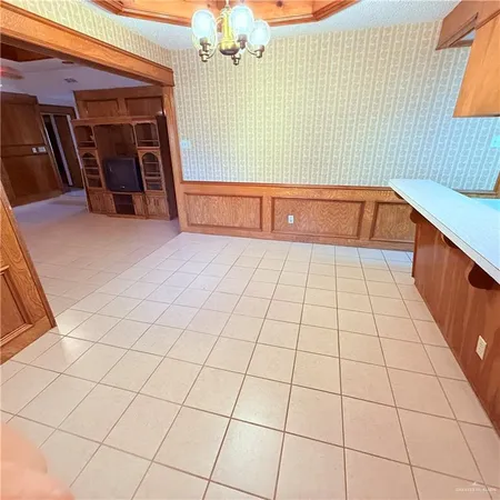 a view of a livingroom with an empty space and a tub