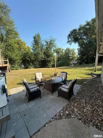 a view of a swimming pool with a lounge chair