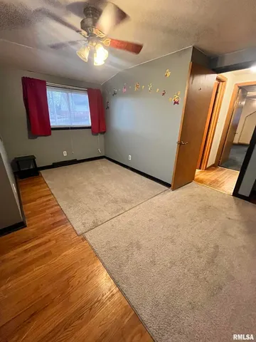 a view of a hall with a flat screen tv