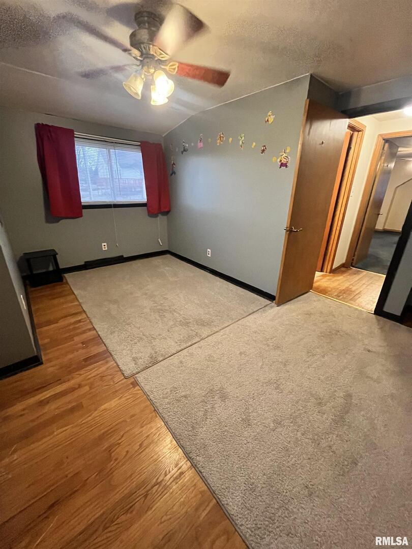 917 South 8th Street Clinton, IA 52732 - Photo 7 of 15 a view of a hall with a flat screen tv