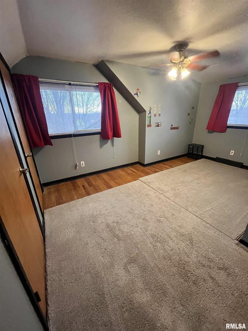917 South 8th Street Clinton, IA 52732 - Photo 8 of 15 a view of an empty room with window and cabinet
