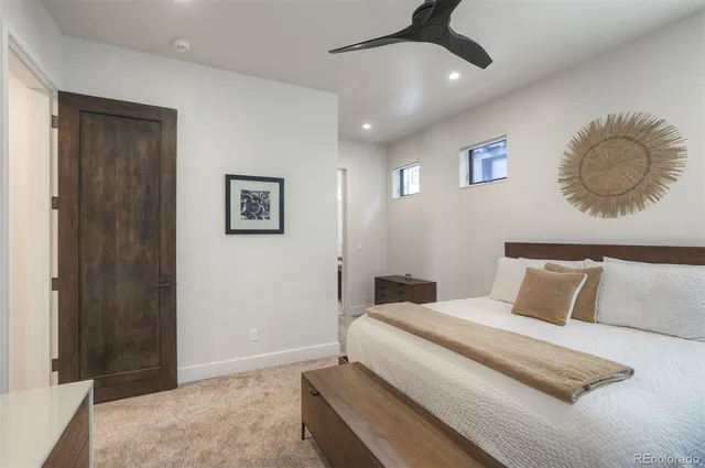 a bedroom with a bed and cabinets