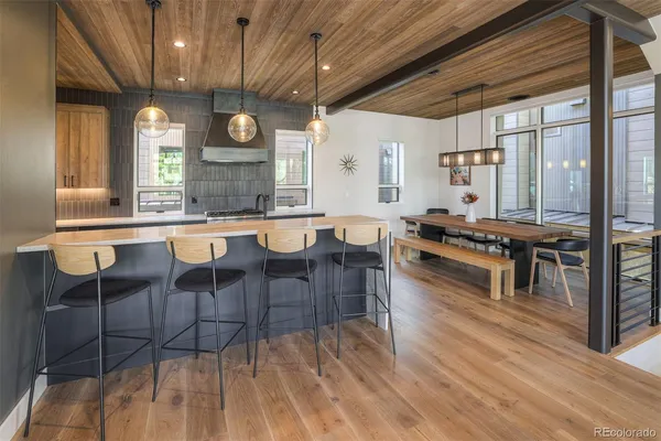 a large kitchen with lots of counter space and stainless steel appliances