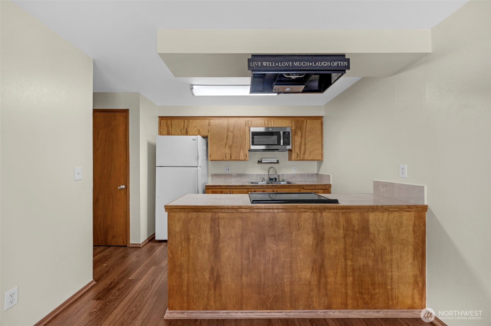 212 Madison Street Everett, WA 98203 - Photo 11 of 40 a kitchen with stainless steel appliances a refrigerator and a stove