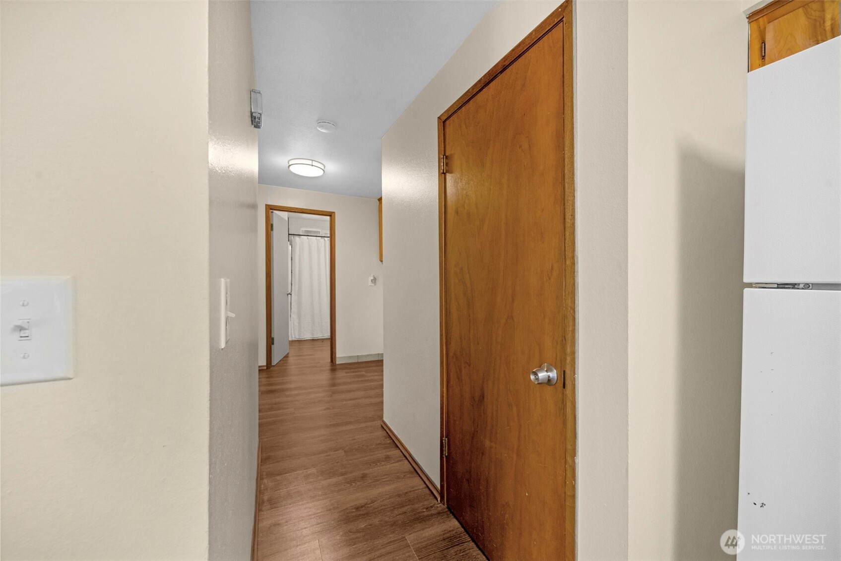 212 Madison Street Everett, WA 98203 - Photo 12 of 40 a view of a hallway with wooden floor