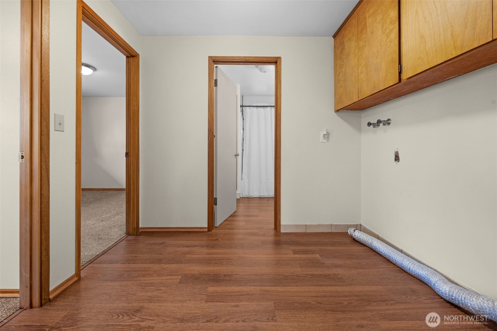 212 Madison Street Everett, WA 98203 - Photo 13 of 40 a view of an empty room with wooden floor