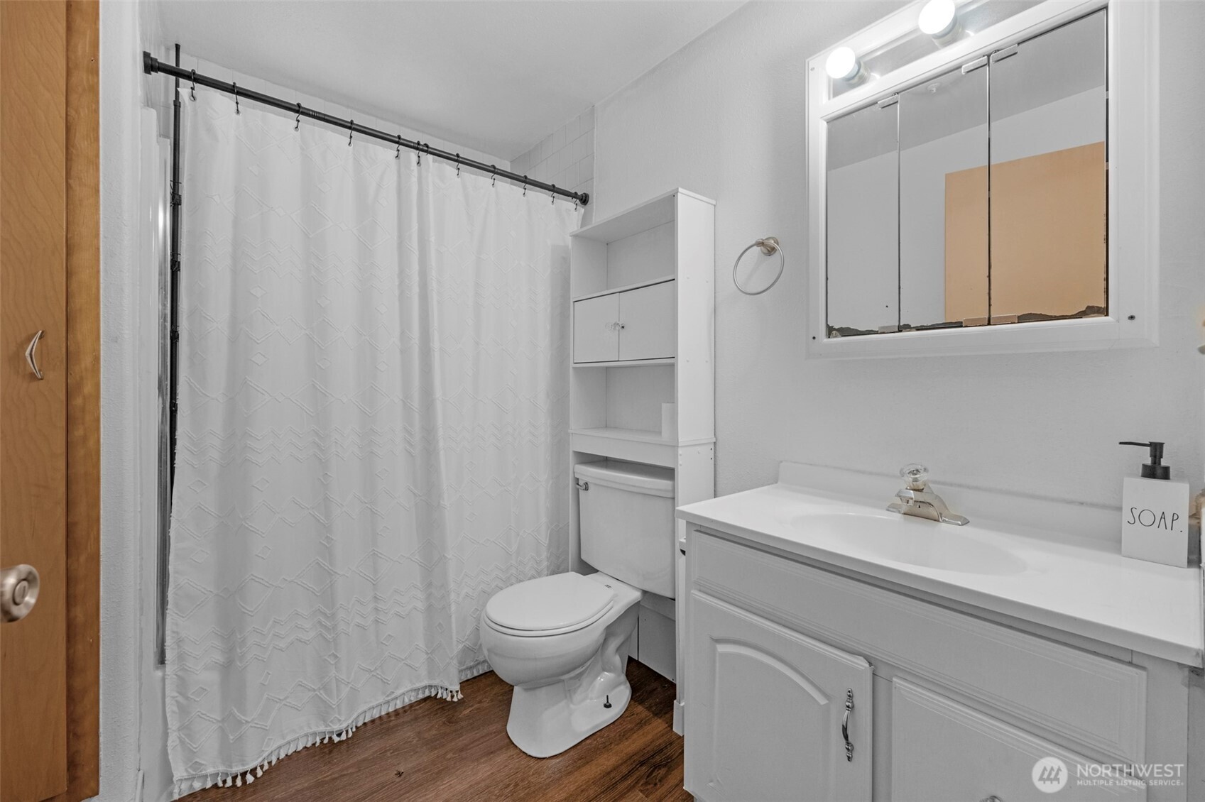 212 Madison Street Everett, WA 98203 - Photo 15 of 40 a bathroom with a sink a toilet and shower