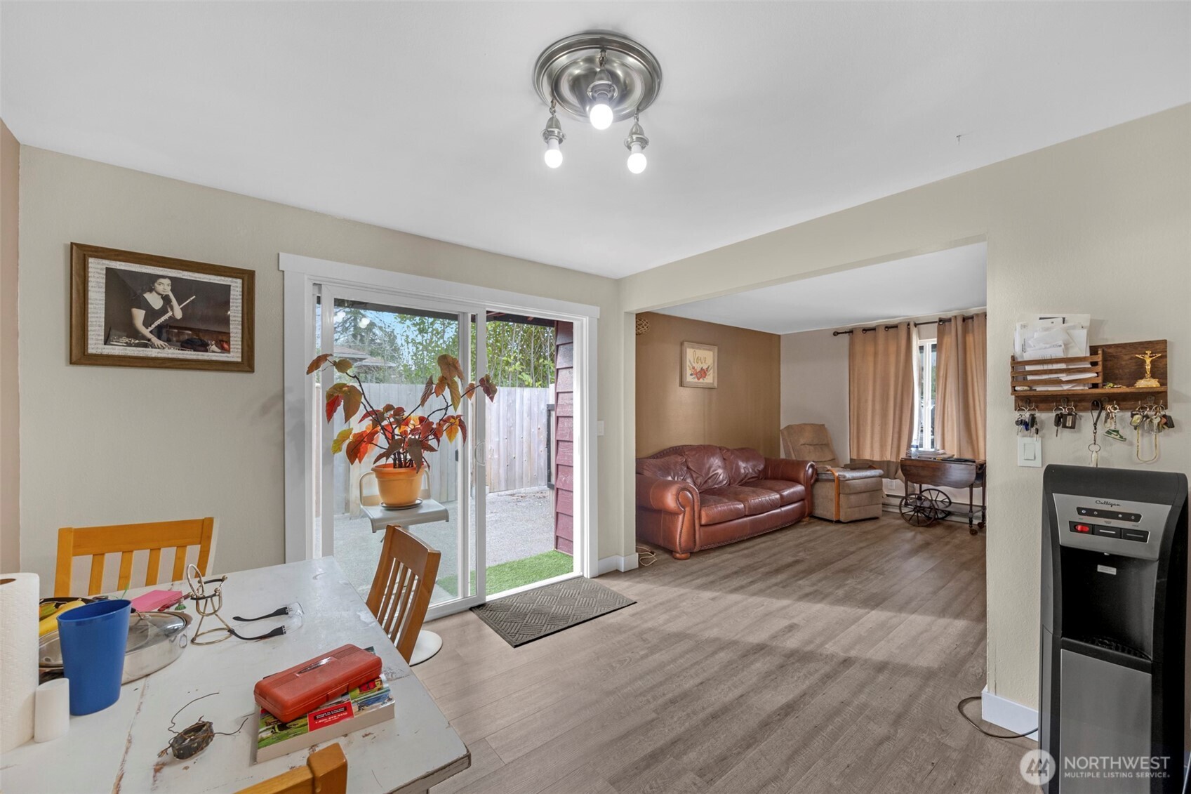 212 Madison Street Everett, WA 98203 - Photo 22 of 40 a bedroom with furniture and a chandelier