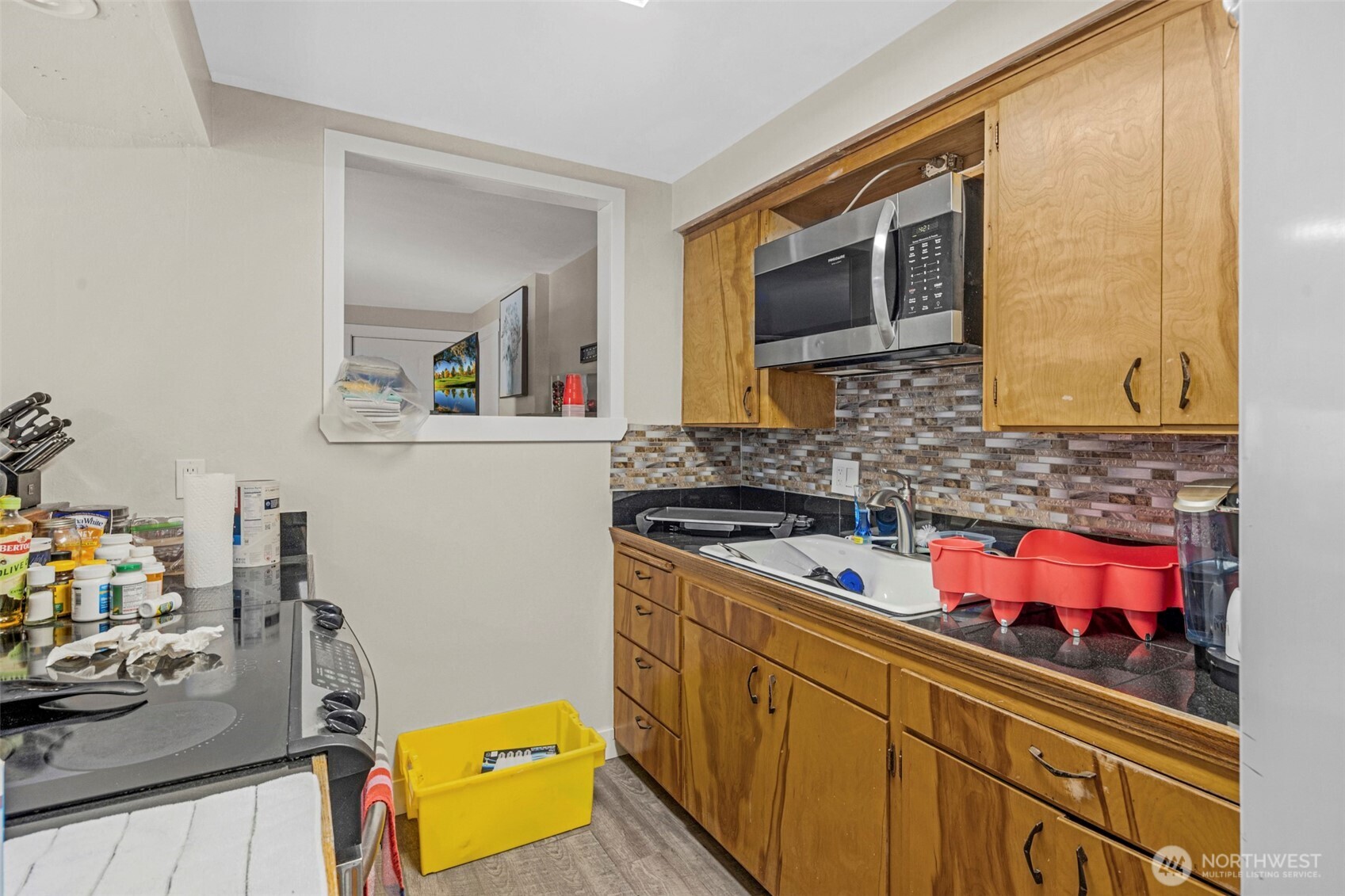 212 Madison Street Everett, WA 98203 - Photo 23 of 40 a kitchen with a sink stove and microwave
