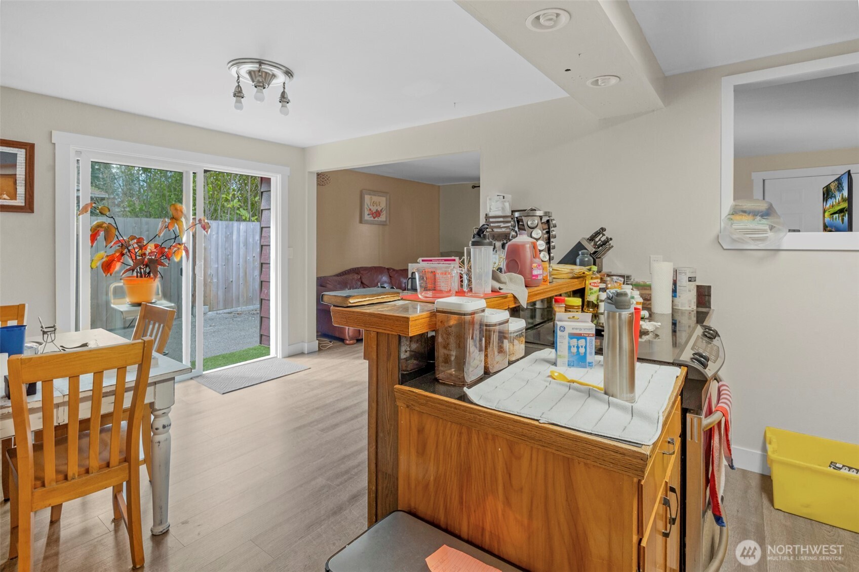 212 Madison Street Everett, WA 98203 - Photo 24 of 40 a view of a dining room with furniture and a chandelier