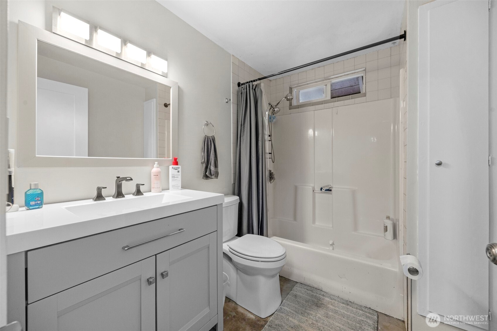 212 Madison Street Everett, WA 98203 - Photo 26 of 40 a bathroom with a shower sink vanity mirror and toilet