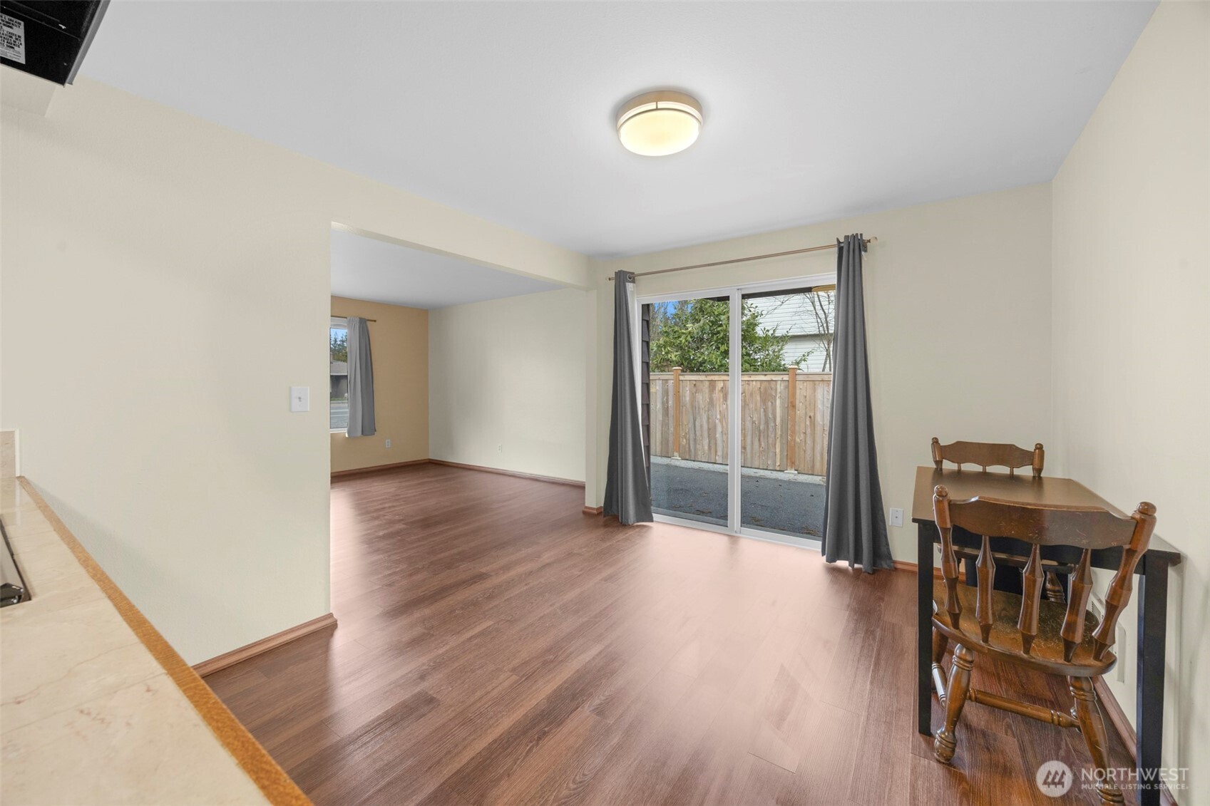 212 Madison Street Everett, WA 98203 - Photo 7 of 40 a view of room with wooden floor and windows