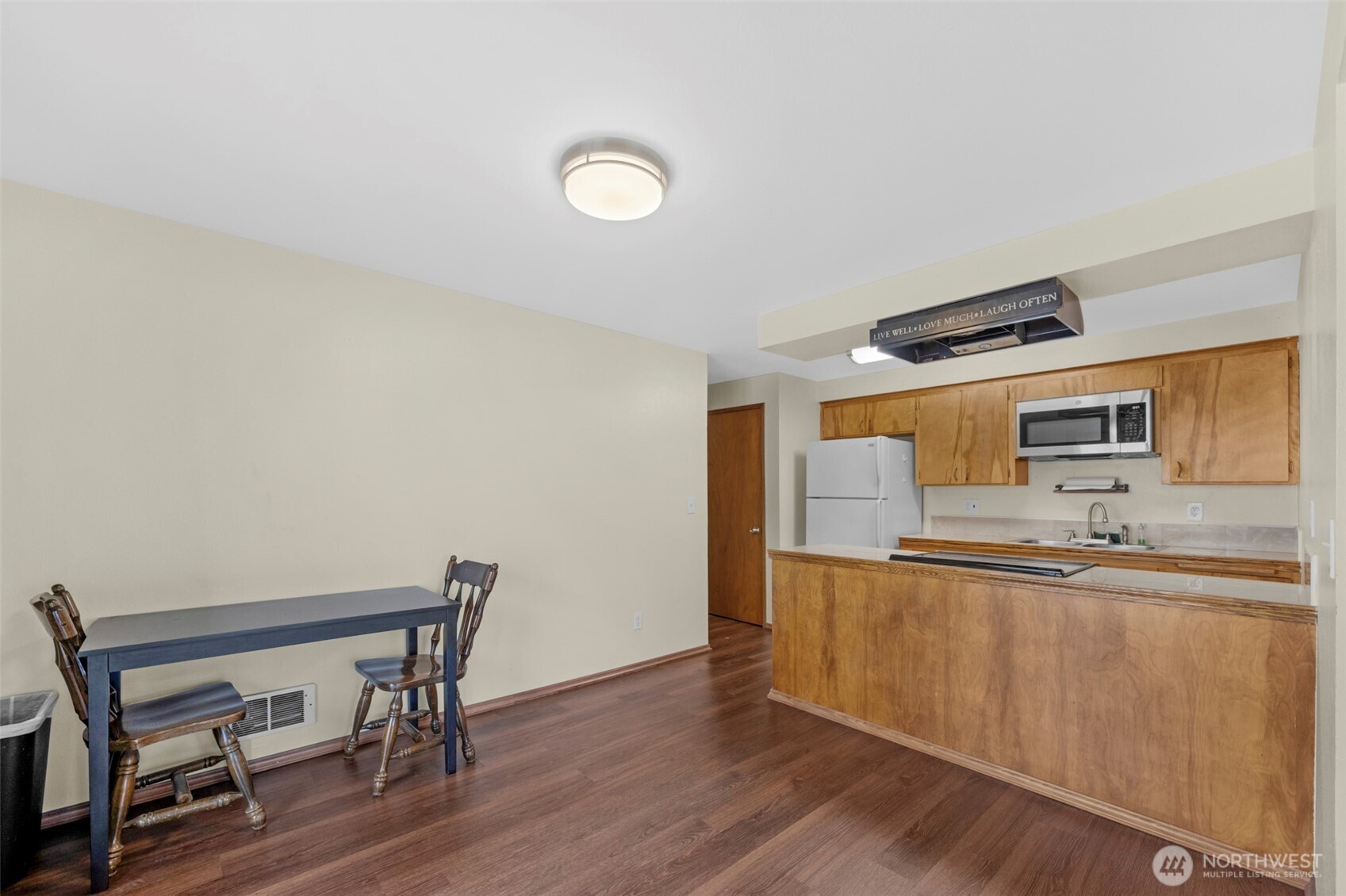 212 Madison Street Everett, WA 98203 - Photo 10 of 40 a kitchen with granite countertop a sink cabinets and wooden floor