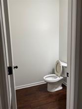313 Clover Brook Drive Locust Grove, GA 30248 - Photo 10 of 13 a white toilet sitting next to a white cabinet