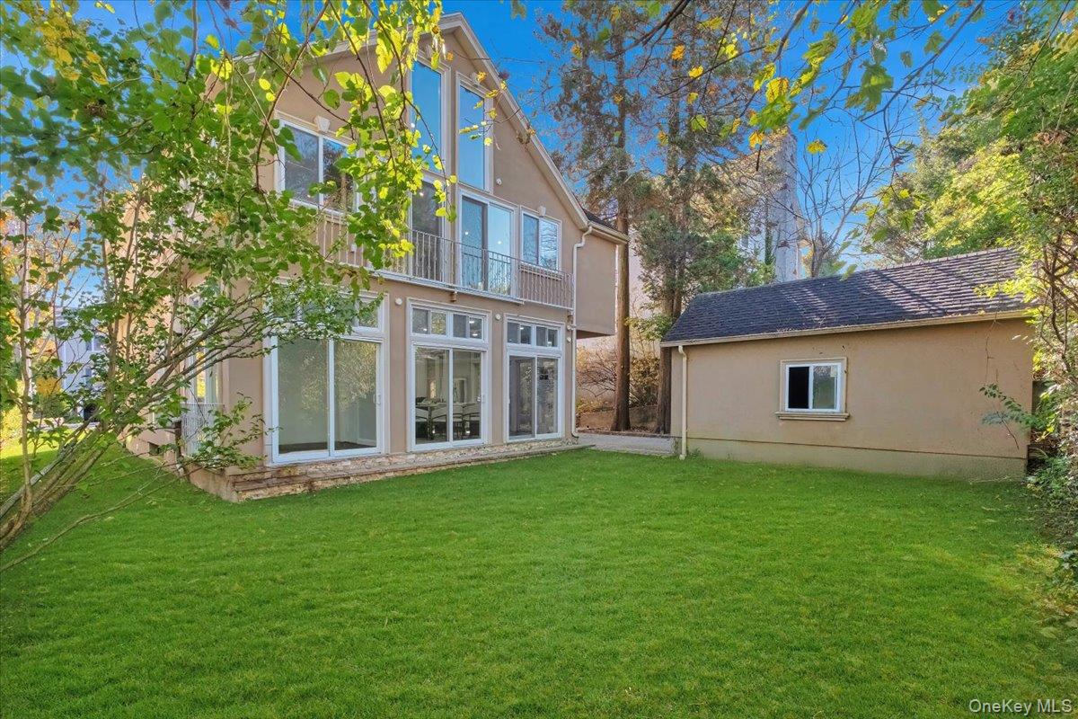 193 Nelson Road Scarsdale, NY 10583 - Photo 32 of 37 a view of a house with a yard