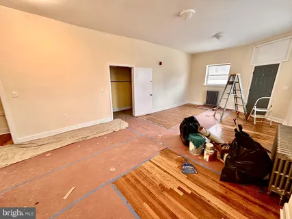 a bed room with a bed and a television