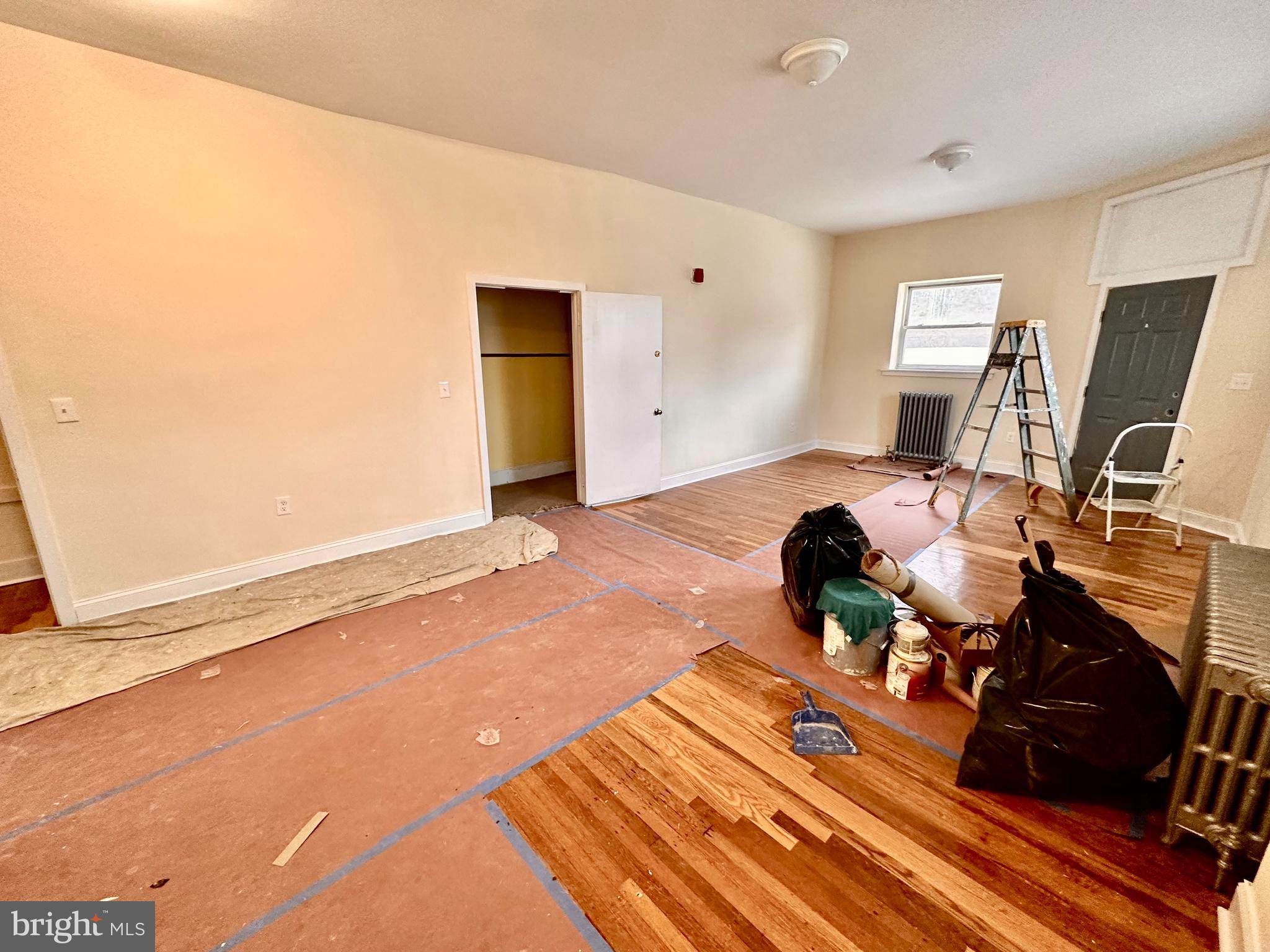 a bed room with a bed and a television