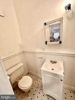 a bathroom with a toilet and a sink