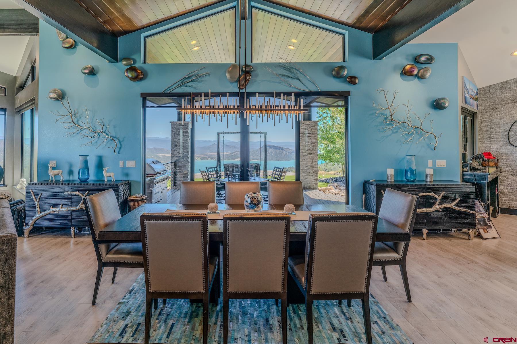 2286 Deer Valley Road Hesperus, CO 81326 - Photo 14 of 44 a dining room with furniture a chandelier and wooden floor