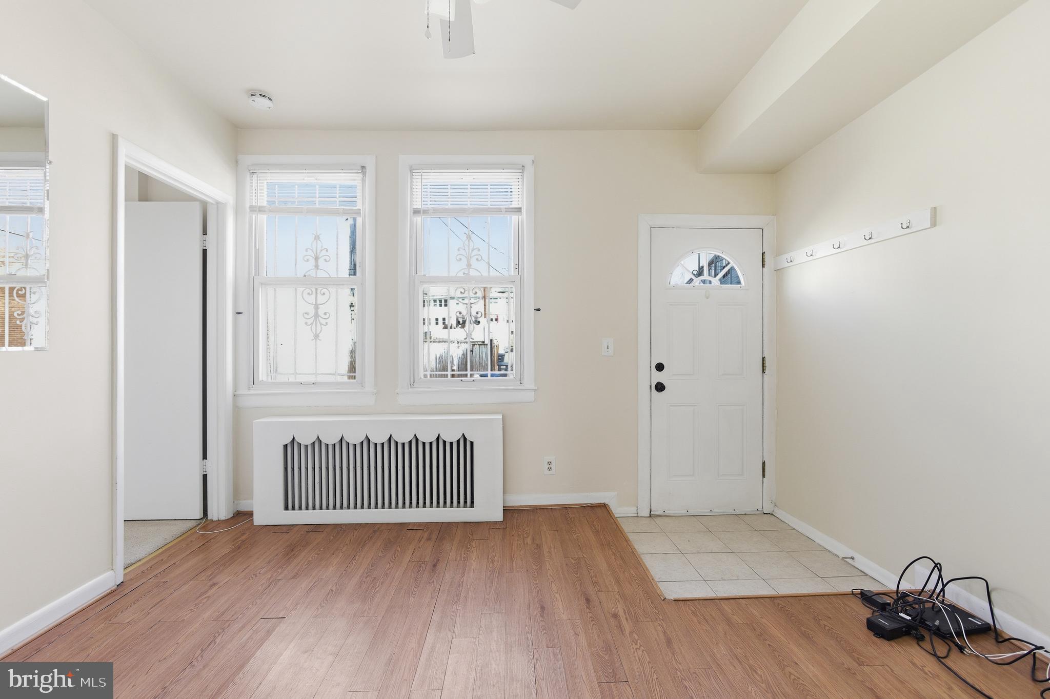 6 Barney Circle Southeast, Unit 1 Washington, DC 20003 - Photo 8 of 14 wooden floor in an empty room with a window