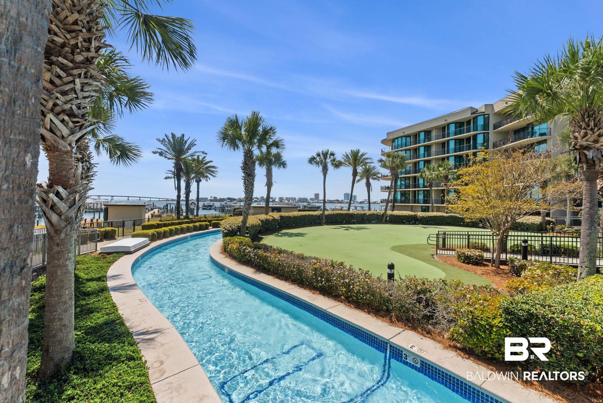 27580 Canal Road, Unit 1233 Orange Beach, AL 36561 - Photo 65 of 79 Community pool with a putting area