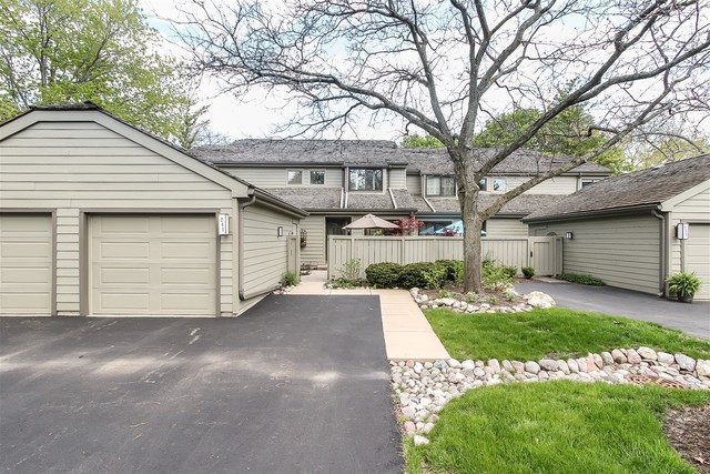241 Timber Ridge Lane Lake Barrington, IL 60010 - Photo 1 of 33 a view of a house with a yard and garage