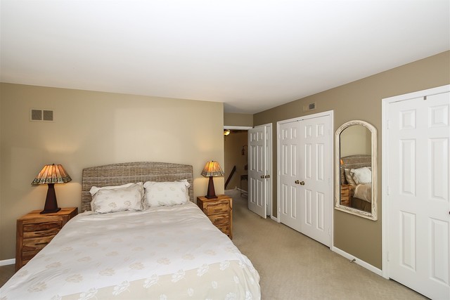 241 Timber Ridge Lane Lake Barrington, IL 60010 - Photo 17 of 33 a bedroom with a bed and wooden floor