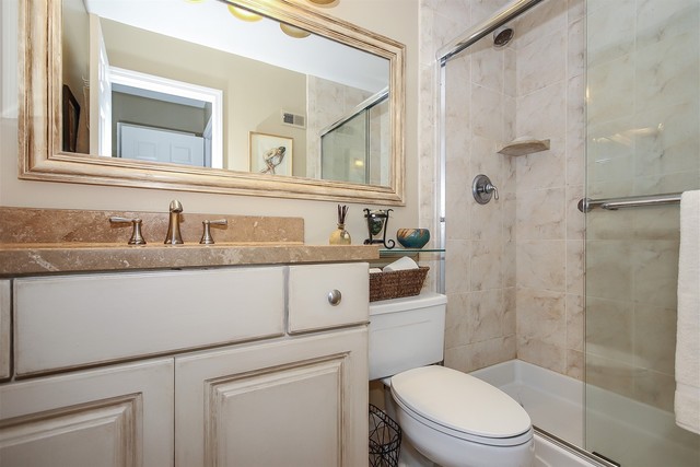 241 Timber Ridge Lane Lake Barrington, IL 60010 - Photo 18 of 33 a bathroom with a sink a toilet and shower