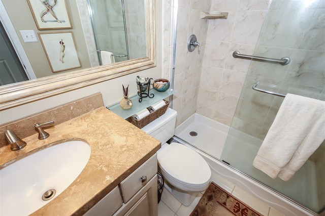 241 Timber Ridge Lane Lake Barrington, IL 60010 - Photo 19 of 33 a bathroom with a granite countertop sink toilet and shower