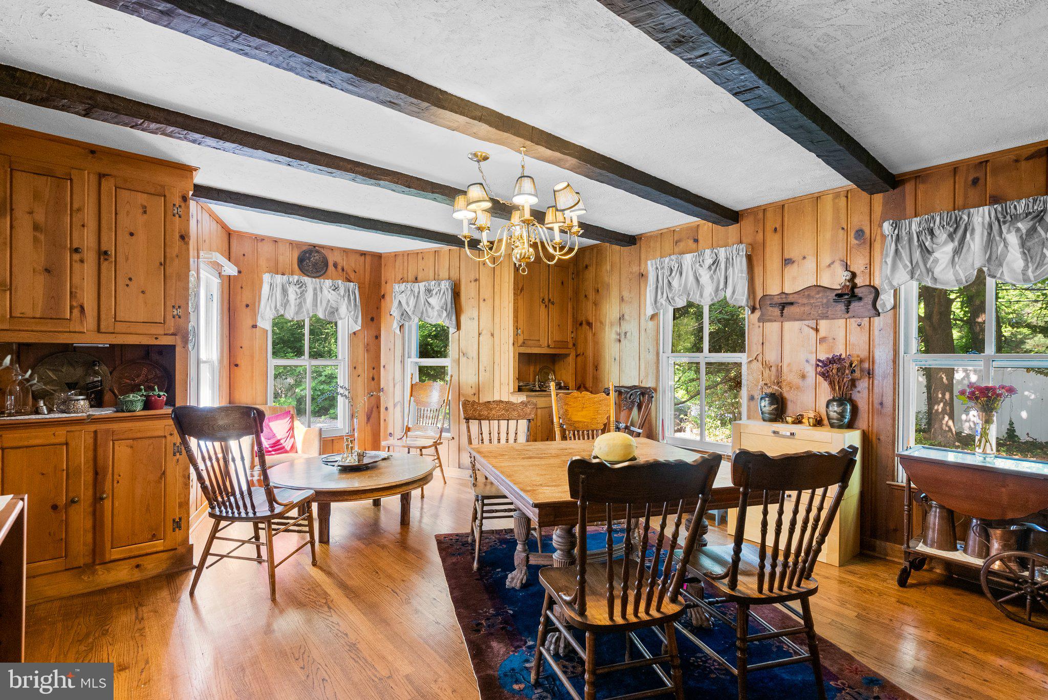 13321 Travilah Road Potomac, MD 20854 - Photo 11 of 43 a view of a dining room with furniture window and wooden floor
